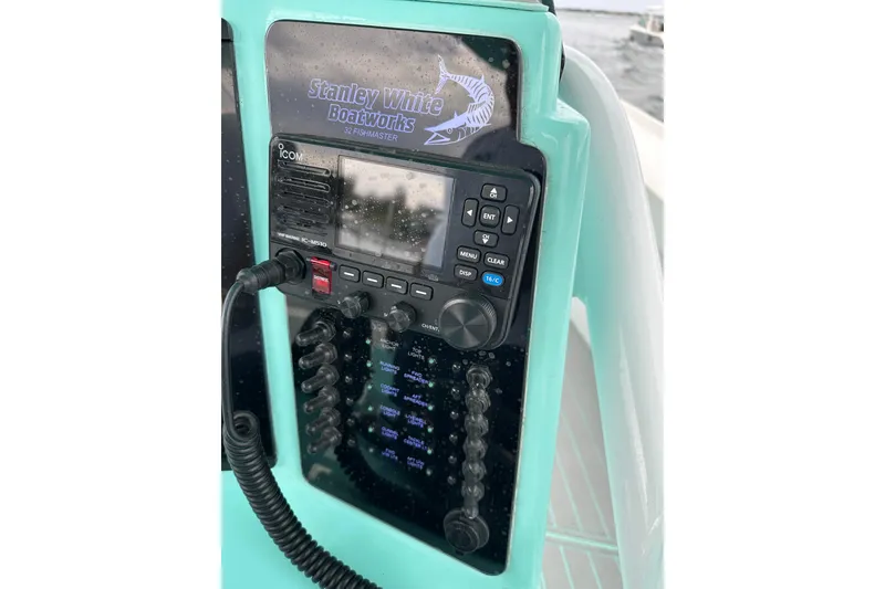 Slide: The Image of Control panel of 2026 Stanley White Fishmaster boat with Icom marine radio. - 8