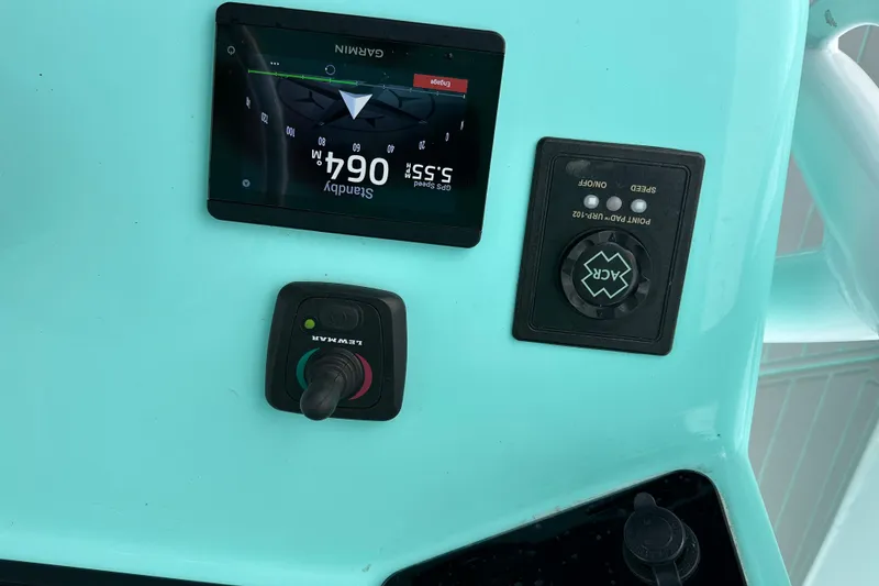 Slide: The Image of Control panel of 2026 Stanley White Fishmaster boat with Garmin display and joystick. - 9