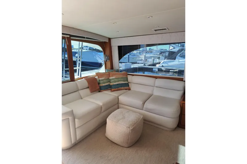 Slide: The Image of Luxurious interior of a 1995 Post 50 Convertible yacht with plush seating and large windows. - 10