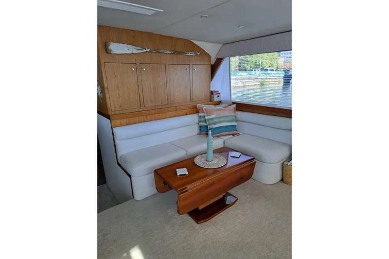 Slide: The Image of Luxurious 1995 Post 50 Convertible yacht interior with cozy seating and elegant decor. - 15