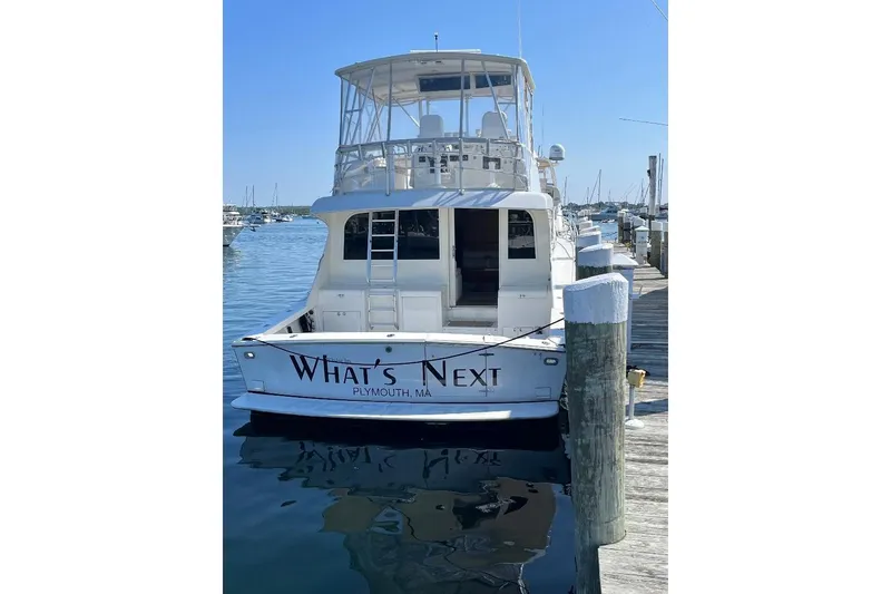 Slide: The Image of 1995 Post 50 Convertible yacht docked in Plymouth, MA, named "What's Next." - 3