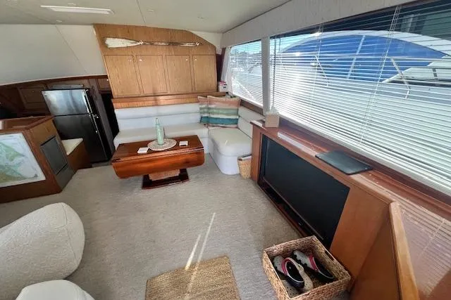 Slide: The Image of Luxurious interior of a 1995 Post 50 Convertible yacht with modern furnishings. - 8