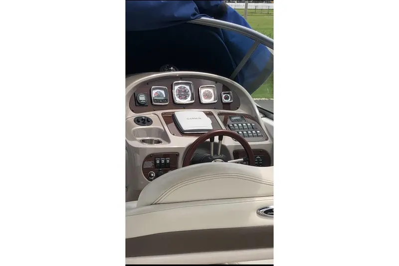 Slide: The Image of 2008 Chaparral Signature 270 dashboard with steering wheel and navigation instruments. - 3