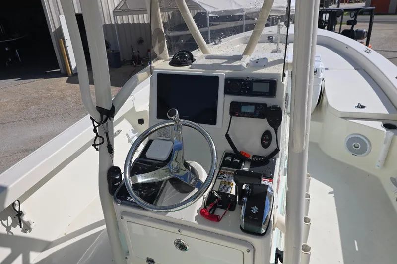 Slide: The Image of 2016 Pathfinder 2600 HPS boat console with steering wheel and navigation equipment. - 10