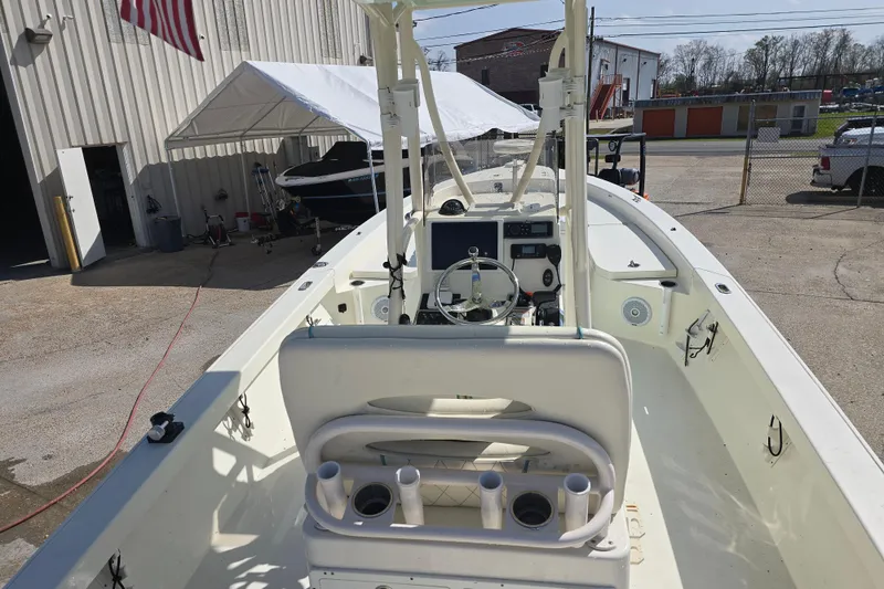 Slide: The Image of 2016 Pathfinder 2600 HPS boat interior with steering wheel and rod holders. - 11