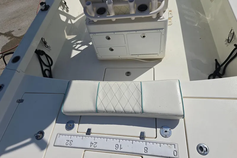 Slide: The Image of 2016 Pathfinder 2600 HPS boat interior with cushioned seating and storage compartments. - 12