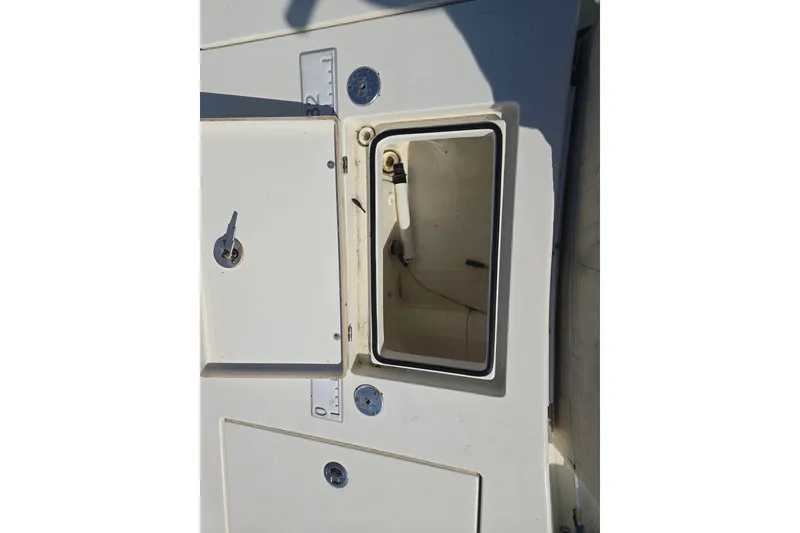 Slide: The Image of Open storage compartment on 2016 Pathfinder 2600 HPS boat deck. - 13