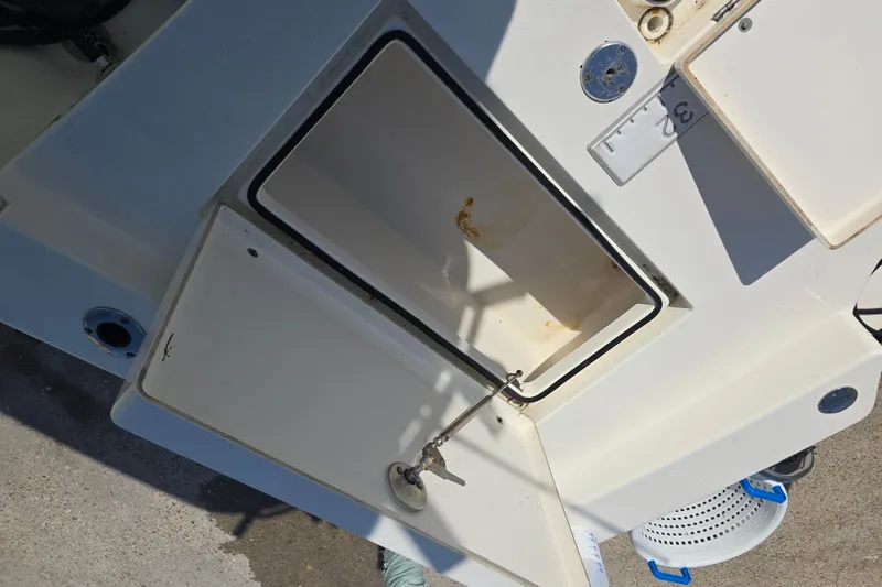 Slide: The Image of Open storage compartment on 2016 Pathfinder 2600 HPS boat, showing interior details. - 14