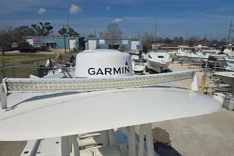 Slide: The Image of 2016 Pathfinder 2600 HPS boat with Garmin radar and LED light bar in a marina. - 17