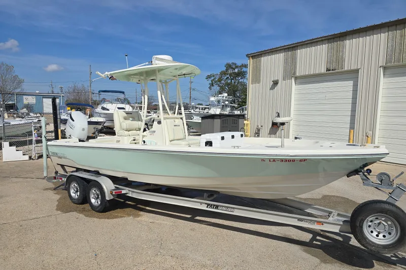Slide: The Image of 2016 Pathfinder 2600 HPS boat on trailer, parked outside a storage facility. - 20