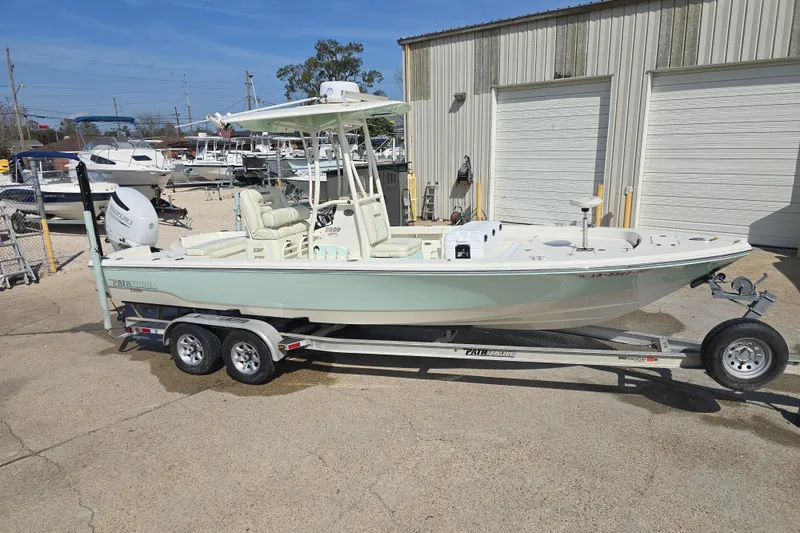 Slide: The Image of 2016 Pathfinder 2600 HPS boat on trailer, parked outside a storage facility. - 21