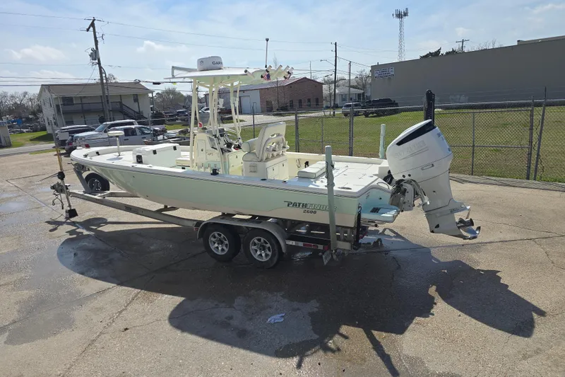 Slide: The Image of 2016 Pathfinder 2600 HPS boat on trailer, parked outdoors in a lot. - 23