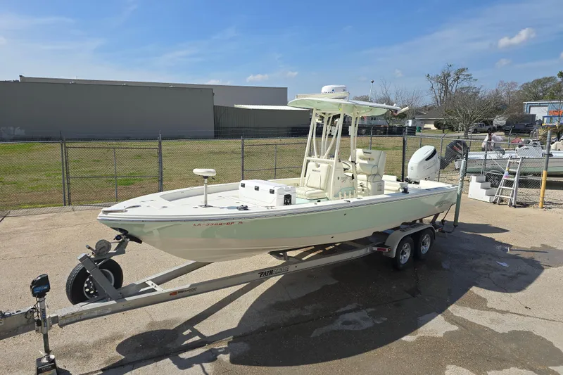 Slide: The Image of 2016 Pathfinder 2600 HPS boat on trailer in outdoor setting. - 25