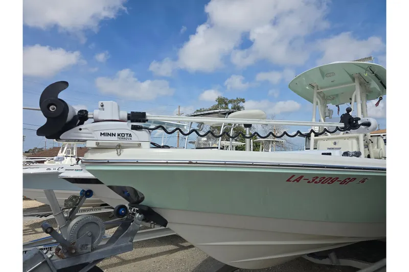 Slide: The Image of 2016 Pathfinder 2600 HPS boat with Minn Kota Terrova motor under a blue sky. - 28