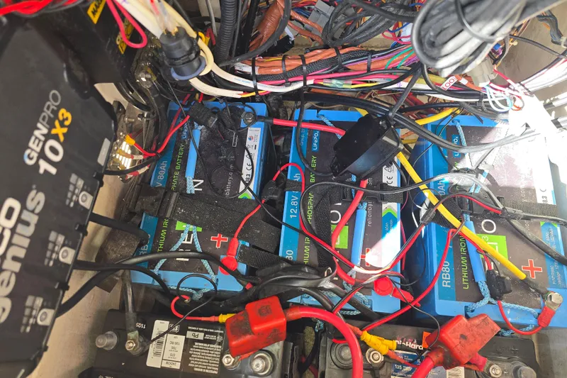 Slide: The Image of 2016 Pathfinder 2600 HPS battery compartment with lithium batteries and wiring setup. - 5