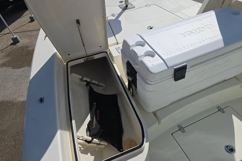 Slide: The Image of Open storage compartment and cooler on 2016 Pathfinder 2600 HPS boat deck. - 7