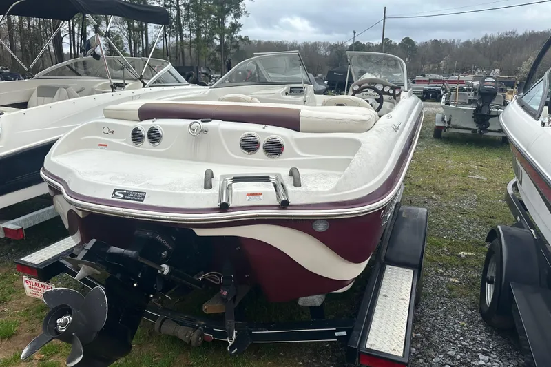Slide: The Image of 2005 Tahoe Q4 Sport boat on trailer, parked outdoors, rear view. - 8