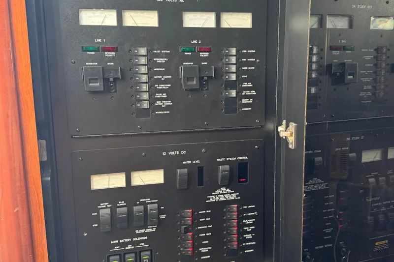 Slide: The Image of Electrical control panel on a 2005 Sea Ray 420 Sundancer yacht. - 14