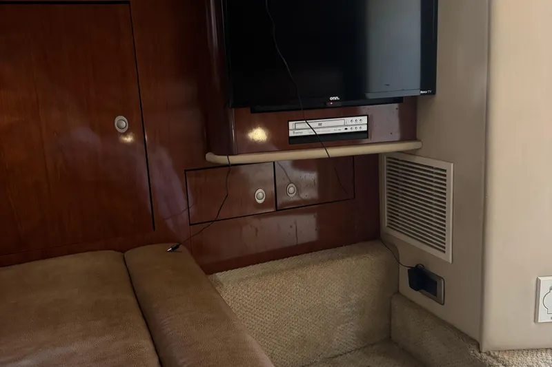 Slide: The Image of Interior of 2005 Sea Ray 420 Sundancer with TV and DVD player setup. - 17
