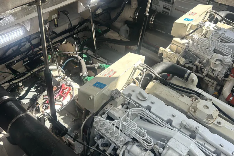 Slide: The Image of Engine room of a 2005 Sea Ray 420 Sundancer with visible machinery and components. - 19