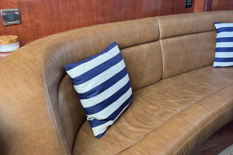 Slide: The Image of Luxurious leather seating with striped cushions on a 2005 Sea Ray 420 Sundancer yacht. - 9