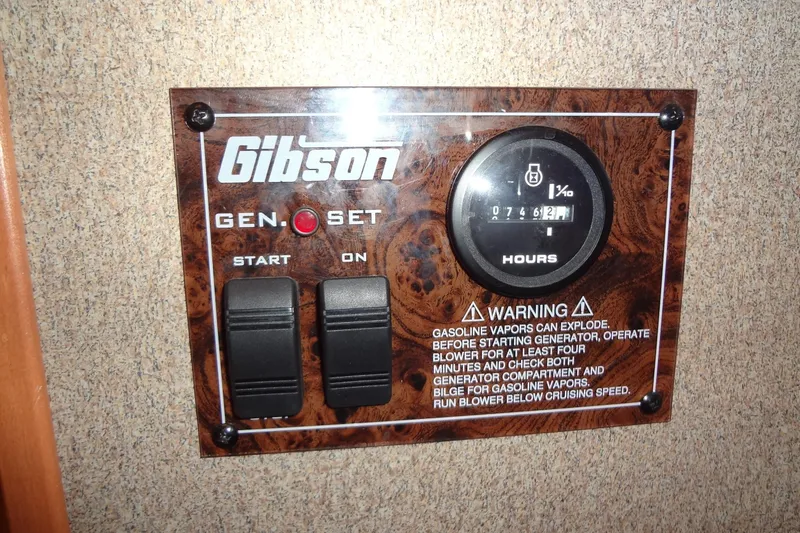 Slide: The Image of Gibson Gen Set control panel with hour meter and warning label, model 44, 2005. - 25