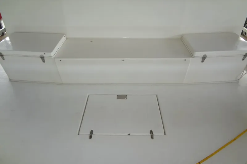Slide: The Image of White storage bench on a 2005 Gibson 44 boat deck. - 9