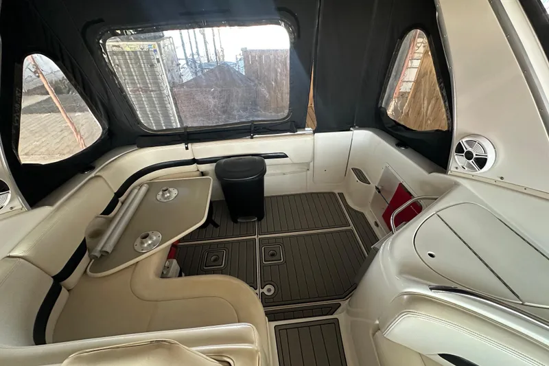 Slide: The Image of 2000 Chaparral Signature 300 boat interior with seating and table setup. - 11