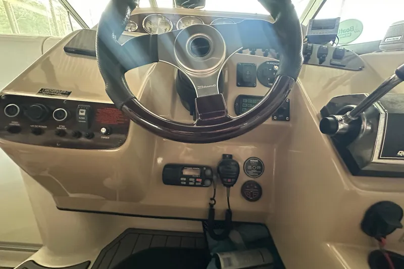 Slide: The Image of Steering wheel and dashboard of a 2000 Chaparral Signature 300 boat. - 14