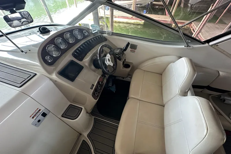 Slide: The Image of Interior cockpit of 2000 Chaparral Signature 300 boat with steering wheel and gauges. - 16