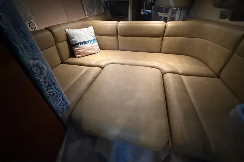 Slide: The Image of Interior of 2000 Chaparral Signature 300 with beige leather seating and decorative pillow. - 26
