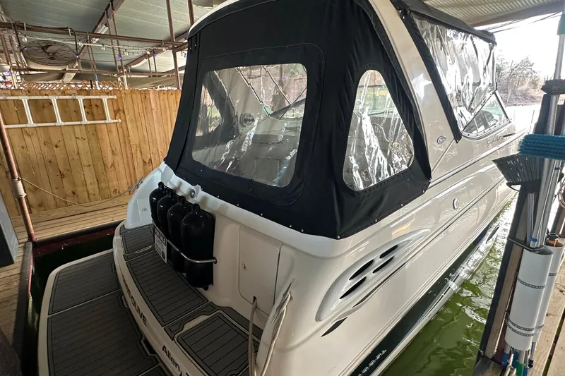 Slide: The Image of Chaparral Signature 300 boat, 2000 model, docked with protective cover in marina. - 3