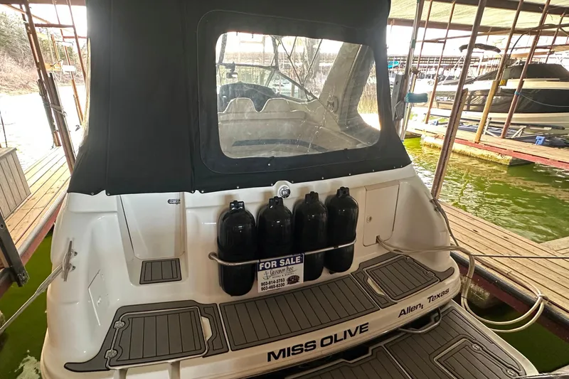 Slide: The Image of Chaparral Signature 300 boat, 2000 model, docked with "For Sale" sign, rear view. - 4