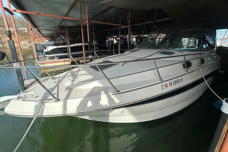 Slide: The Image of Chaparral Signature 300 boat, 2000 model, docked in a marina under a covered structure. - 6