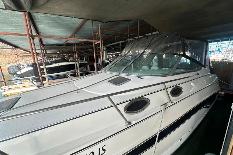 Slide: The Image of Chaparral Signature 300 boat from 2000 docked under a covered marina. - 7