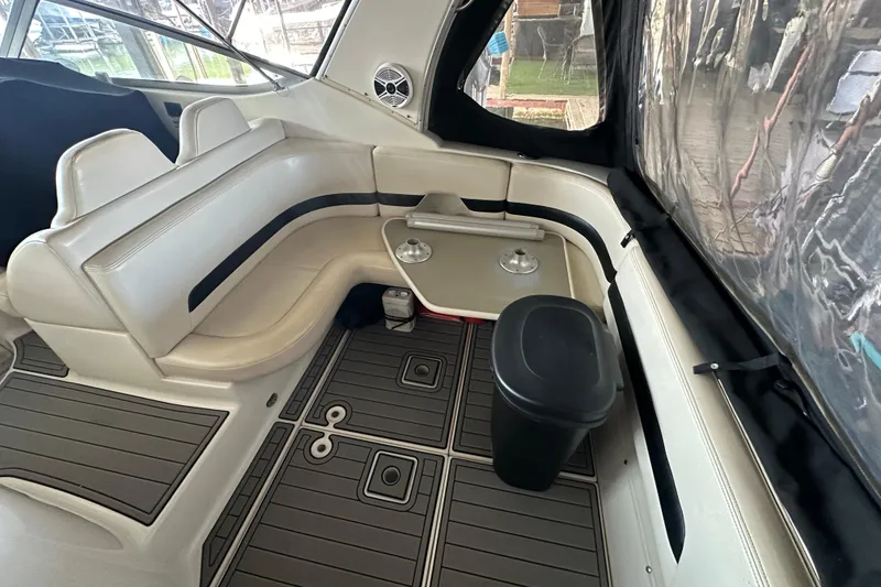 Slide: The Image of 2000 Chaparral Signature 300 boat interior with white seating and modern flooring. - 9