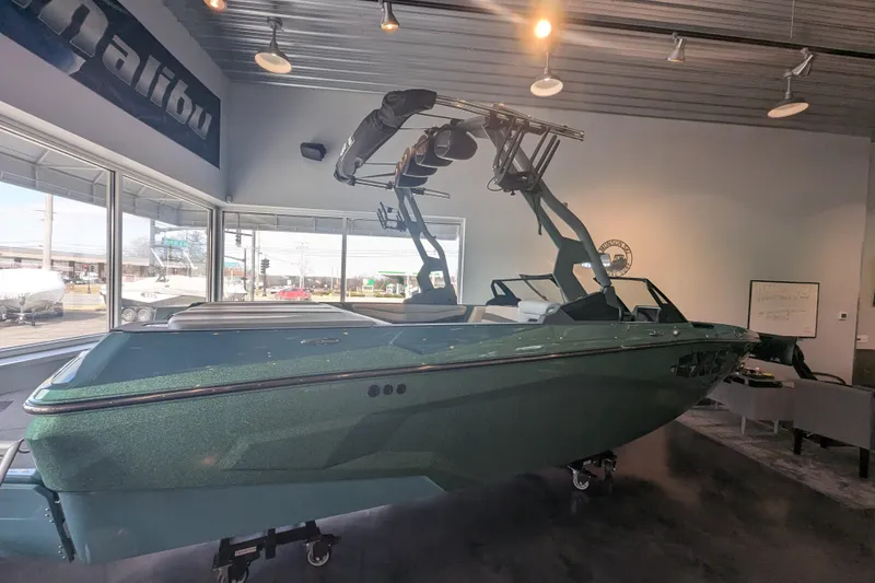 Slide: The Image of 2026 Axis A200 boat displayed indoors with sleek design and modern features. - 1