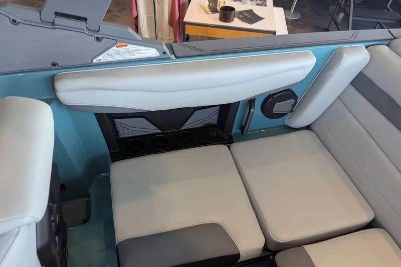 Slide: The Image of 2026 Axis A200 boat interior with cushioned seating and cup holders. - 11