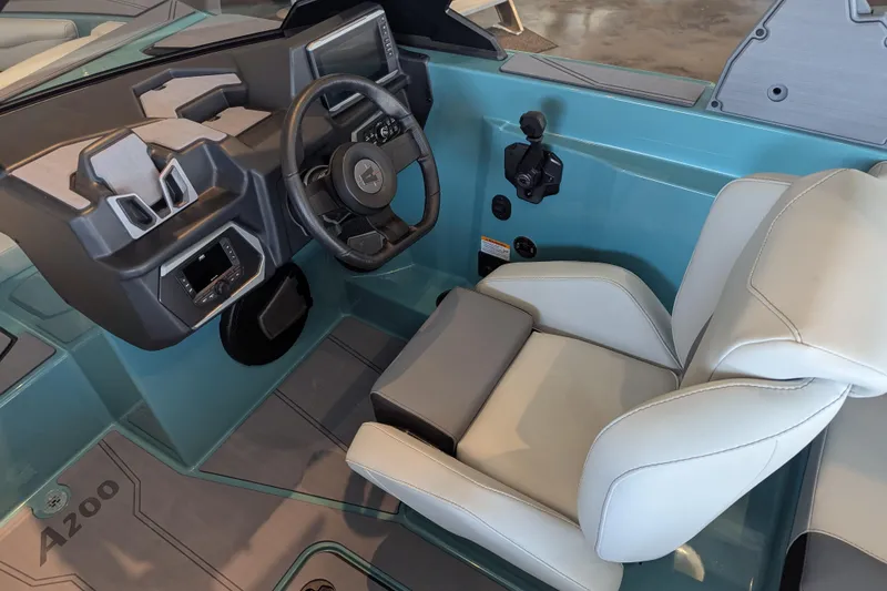 Slide: The Image of Interior of 2026 Axis A200 boat featuring modern steering and comfortable seating. - 5
