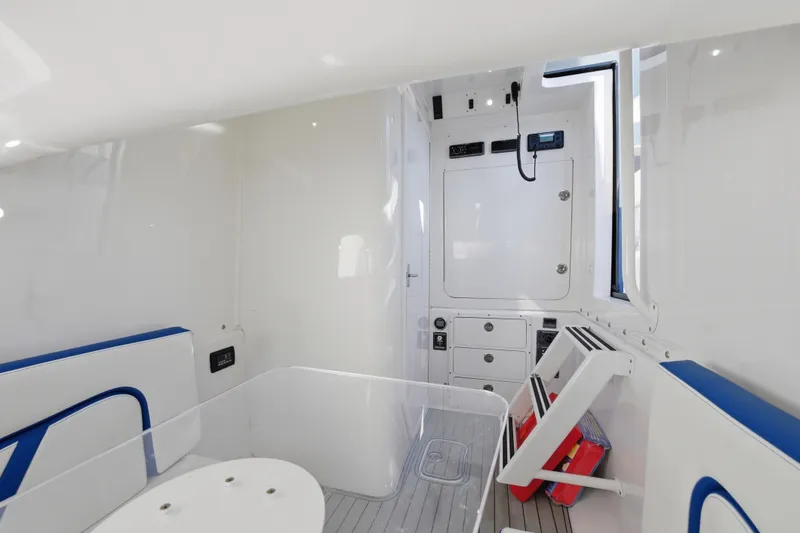 Slide: The Image of 2019 Midnight Express 43 Open interior with modern white and blue design. - 20