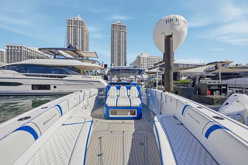 Slide: The Image of 2019 Midnight Express 43 Open yacht docked at marina with city skyline. - 7
