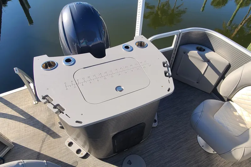 Slide: The Image of 2023 Bennington L23 boat interior with helm station and seating, featuring modern design elements. - 18