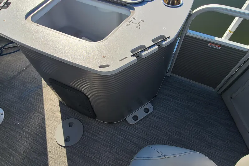 Slide: The Image of 2023 Bennington L23 boat interior with storage compartment and seating. - 20