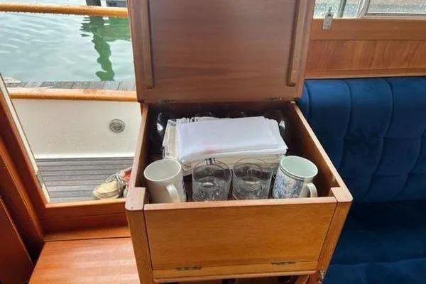 Slide: The Image of Storage compartment on 2000 Grand Banks 36 Classic yacht with mugs and glasses. - 16
