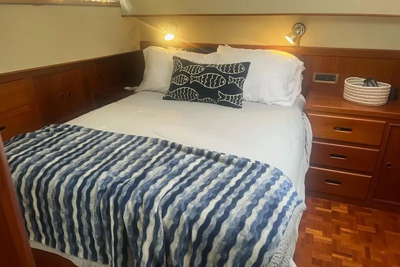 Slide: The Image of Cozy bedroom in 2000 Grand Banks 36 Classic yacht with nautical decor. - 18