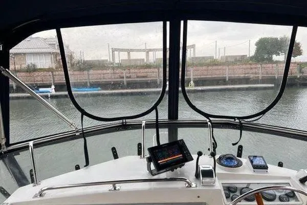 Slide: The Image of Helm view from 2000 Grand Banks 36 Classic yacht, featuring navigation equipment. - 2