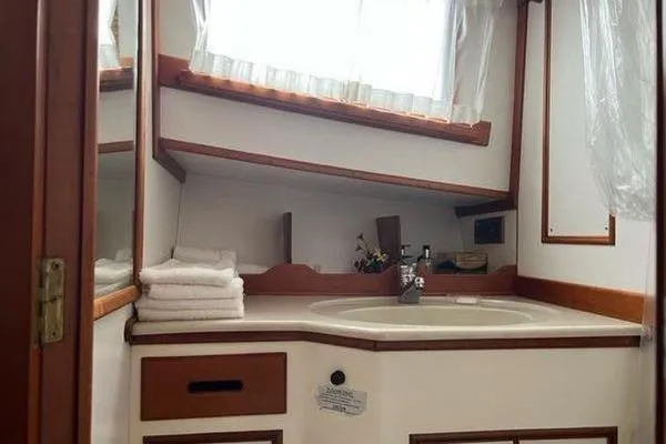 Slide: The Image of Bathroom interior of 2000 Grand Banks 36 Classic yacht with sink and towels. - 22