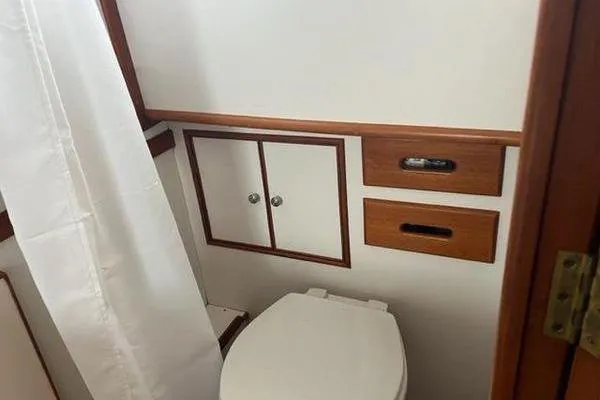 Slide: The Image of Bathroom interior of 2000 Grand Banks 36 Classic yacht with wooden accents. - 25