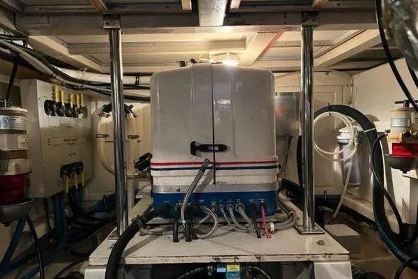 Slide: The Image of Engine room of 2000 Grand Banks 36 Classic yacht with visible machinery and wiring. - 27