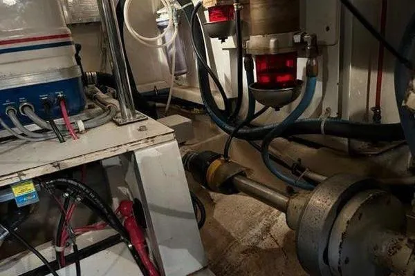 Slide: The Image of Engine room of a 2000 Grand Banks 36 Classic boat, showcasing mechanical components. - 34